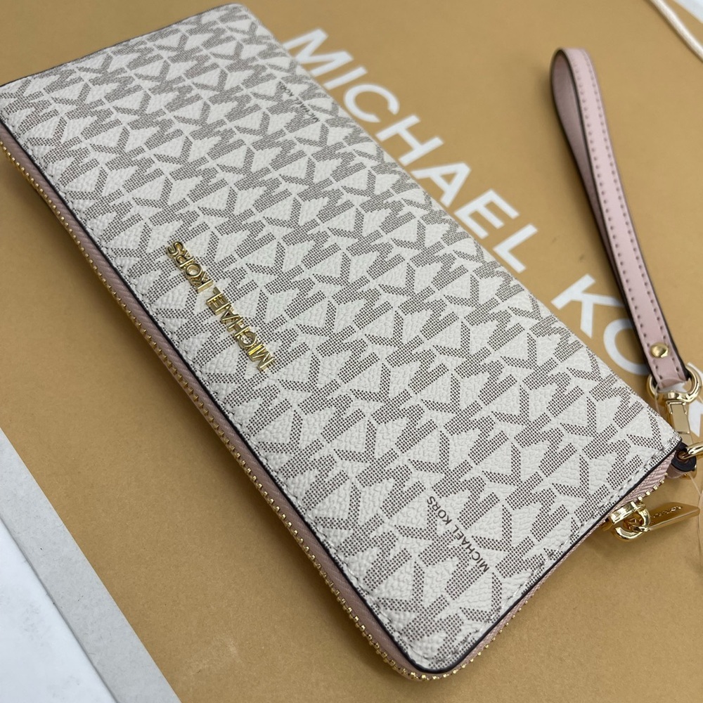 MICHAEL KORS Jet Set Travel Lg Signature Logo Continental Wristlet 
POWDER BLUSH